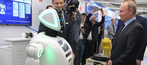 Russian President Vladimir Putin views a showroom of small and medium-size businesses engaged in 'digital economy' as he visits the ER-Telecom Holding in Perm Russian President Vladimir Putin views a showroom of small and medium-size businesses engaged in 'digital economy' as he visits the ER-Telecom Holding in Perm - Sputnik International