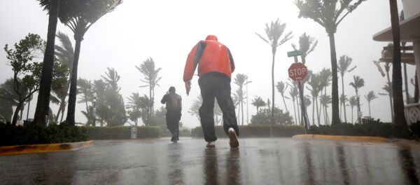 People walk along a street in South Beach as Hurricane Irma arrives at south Florida, in Miami Beach, Florida, U.S., September 10, 2017 People walk along a street in South Beach as Hurricane Irma arrives at south Florida, in Miami Beach, Florida, U.S., September 10, 2017 - Sputnik International