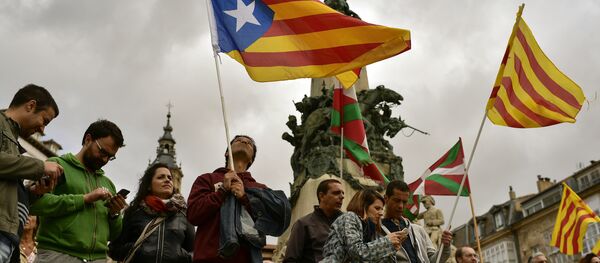 Pro independence supporters wave estelada or pro independence flags during a rally in support for the secession of the Catalonia region from Spain, in Vitoria, northern Spain, Saturday, Sept. 9, 2017 Pro independence supporters wave estelada or pro independence flags during a rally in support for the secession of the Catalonia region from Spain, in Vitoria, northern Spain, Saturday, Sept. 9, 2017 - Sputnik International