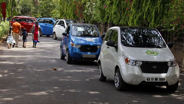 Owners drive Mahindra Reva automatic electric cars in a row during a rally organized to create awareness about energy efficient and alternative modes of personal transport in Bangalore, India, Saturday, June 28, 2014 - Sputnik International
