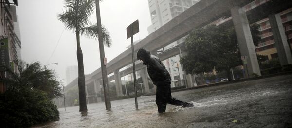 A local resident walks across a flooded street in downtown Miami as Hurricane Irma arrives at south Florida, U.S. September 10, 2017 A local resident walks across a flooded street in downtown Miami as Hurricane Irma arrives at south Florida, U.S. September 10, 2017 - Sputnik International
