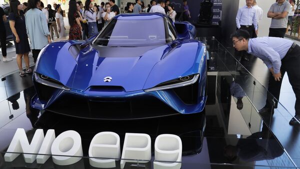 Visitor look at the Nio EP9, an electric-powered two-seated supercar manufactured by NIO during a promotion event at a shopping mall in Beijing - Sputnik International