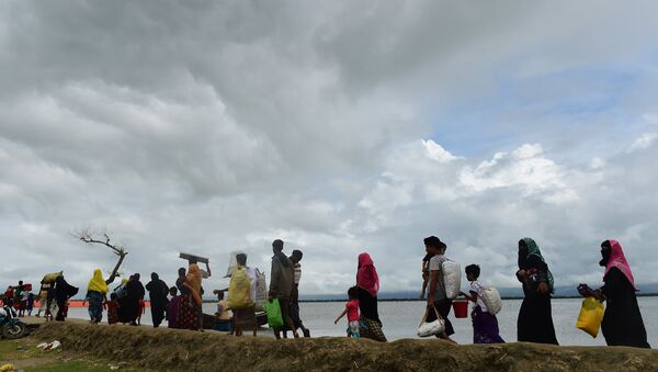 Rohingya Muslim refugees arrive from Myanmar after crossing the Naf river in the Bangladeshi town of Teknaf - Sputnik International