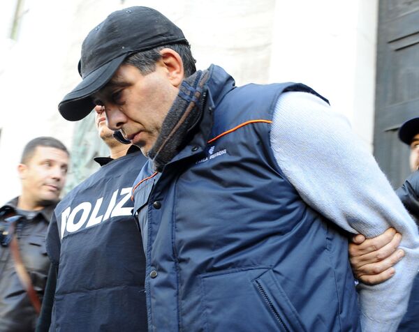A man identified by Italian police as Salvatore Russo, a Camorra crime syndicate boss on the run since 1995, is taken into custody by Italian police, in Naples, Italy. (File) A man identified by Italian police as Salvatore Russo, a Camorra crime syndicate boss on the run since 1995, is taken into custody by Italian police, in Naples, Italy. (File) - Sputnik International
