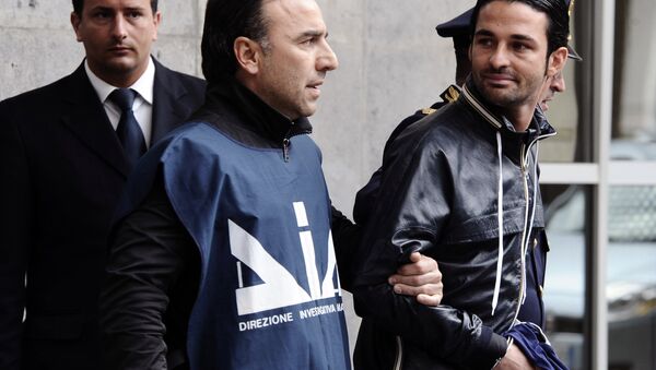Paolo Schiavone, right, is escorted by Police officers after being arrested at Naples's port, Italy. (File) - Sputnik International