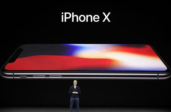 Apple CEO Tim Cook announces the new iPhone X at the Steve Jobs Theater on the new Apple campus, Tuesday, Sept. 12, 2017, in Cupertino, California. Apple CEO Tim Cook announces the new iPhone X at the Steve Jobs Theater on the new Apple campus, Tuesday, Sept. 12, 2017, in Cupertino, California. - Sputnik International