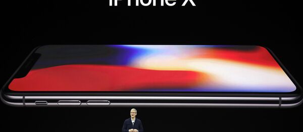 Apple CEO Tim Cook announces the new iPhone X at the Steve Jobs Theater on the new Apple campus, Tuesday, Sept. 12, 2017, in Cupertino, California. Apple CEO Tim Cook announces the new iPhone X at the Steve Jobs Theater on the new Apple campus, Tuesday, Sept. 12, 2017, in Cupertino, California. - Sputnik International