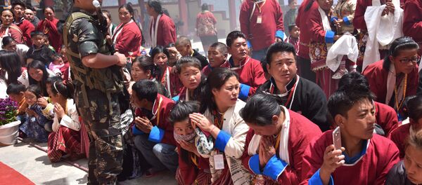 Buddhist followers wait for exiled Tibetan spiritual leader the Dalai Lama at Urgelling Monastery, the birthplace of the 6th Dalai Lama, in the district of Tawang in India's north-eastern state of Arunachal Pradesh on April 9, 2017 - Sputnik International