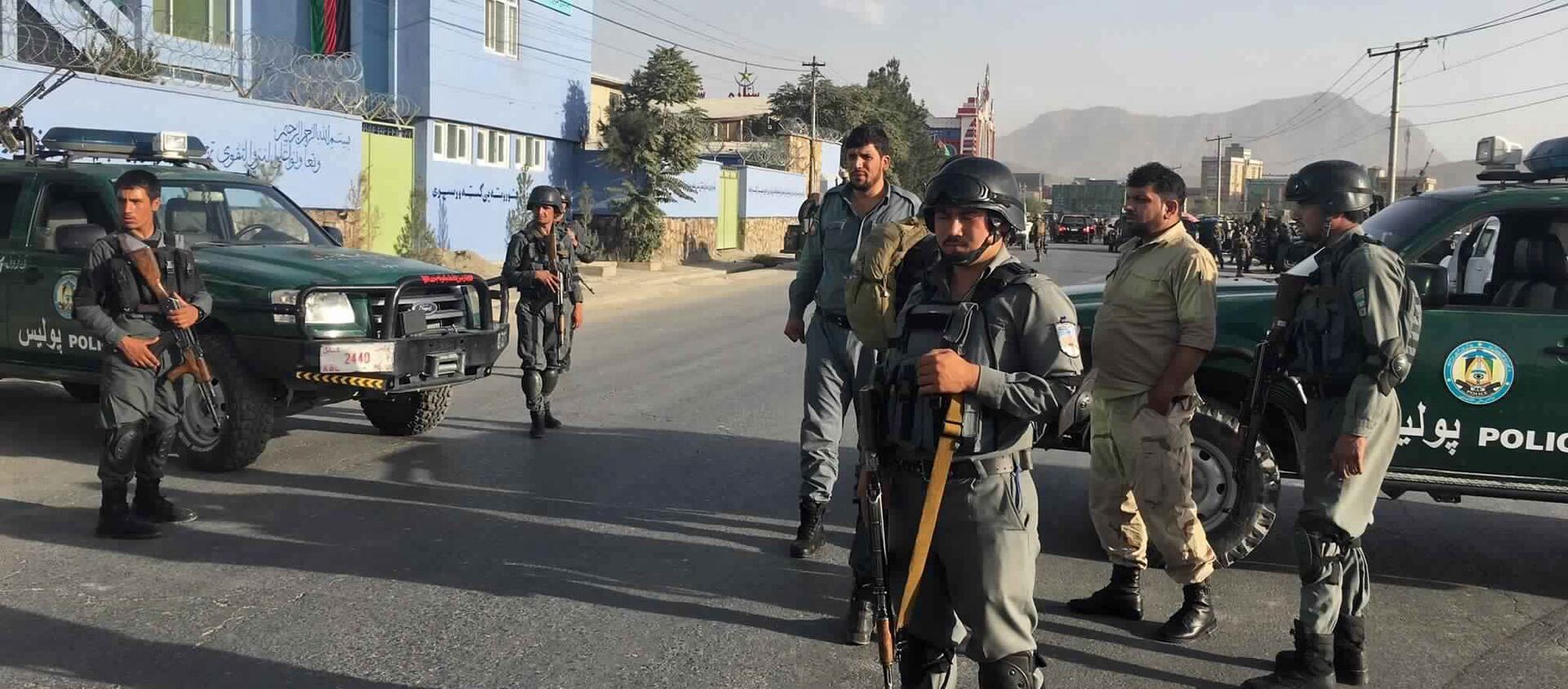 Afghan security police stand guard near the site of a deadly suicide attack outside a cricket stadium, in Kabul, Afghanistan - Sputnik International, 1920, 10.07.2021
