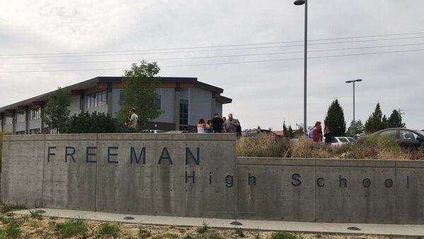 People gather outside of Freeman High School after reports of a shooting at the school in Rockford, Wash., Wednesday, Sept. 13, 2017. - Sputnik International
