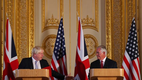 Britain's Foreign minister Boris Johnson (L) and US Secretary of State Rex Tillerson take part in a joint press conference after their meeting on Libya, at Lancaster House in London - Sputnik International