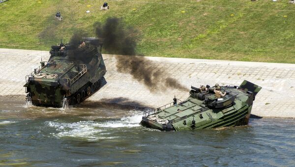 This Sept. 6, 2016, photo released by the U.S. Marine Corps shows Marines with the 2nd Amphibious Assault Battalion aboard AAV-7 Amphibious Assault vehicles during an exercise on the Cumberland River in Nashville, Tenn. - Sputnik International