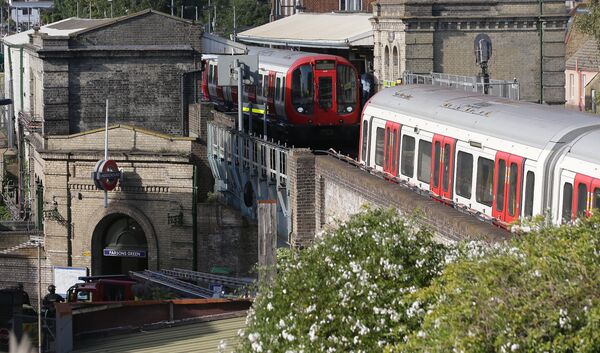 Members of the emergency services work alongside an underground tube train at a platform at Parsons Green underground tube station in west London on September 15, 2017, following an incident on an underground tube carriage at the station - Sputnik International