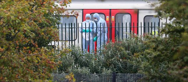 Forensic investigators search next to a London underground tube at Parsons Green station in London, Britain, September 15, 2017 Forensic investigators search next to a London underground tube at Parsons Green station in London, Britain, September 15, 2017 - Sputnik International