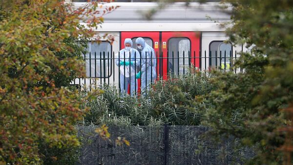 Forensic investigators search next to a London underground tube at Parsons Green station in London, Britain, September 15, 2017 - Sputnik International
