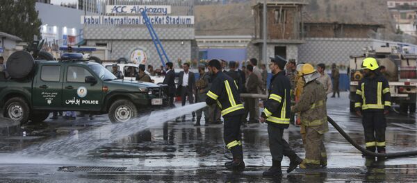 Afghan firefighters work at the site of a suicide attack outside a cricket stadium, in Kabul, Afghanistan - Sputnik International