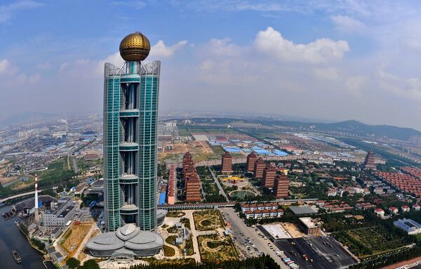 This aerial photo taken on September 25 shows the Longxi International Hotel, standing at 328 metres (1,082-feet) high and costing 470 million USD to build, in Huaxi, which is still classed as a village in east China's Jiangsu province - Sputnik International