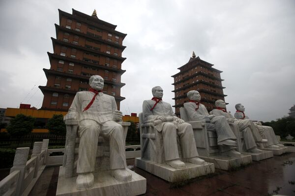 This Aug. 10, 2009 photo shows statues of Deng Xiaoping, Zhou Enlai, Mao Zedong, Zhu De and Liu Shaoqi in front of traditional pagoda-like buildings at Happiness Garden Monday in Huaxi, Jiangsu Province, China This Aug. 10, 2009 photo shows statues of Deng Xiaoping, Zhou Enlai, Mao Zedong, Zhu De and Liu Shaoqi in front of traditional pagoda-like buildings at Happiness Garden Monday in Huaxi, Jiangsu Province, China - Sputnik International