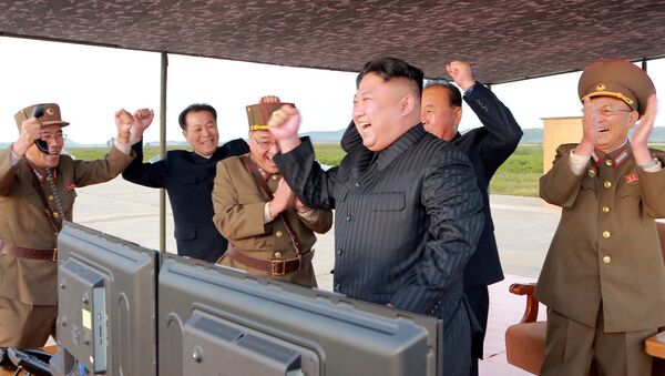 North Korean leader Kim Jong Un guides the launch of a Hwasong-12 missile in this undated photo released by North Korea's Korean Central News Agency (KCNA) on September 16, 2017 - Sputnik International