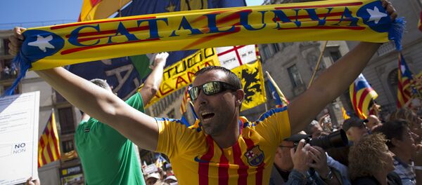 People wave esteladas or independence flags and banners in support of the mayors under investigation as they take part in a march, outside the Generalitat Palace, to protest against the ruling of the constitutional court ahead of a planned independence referendum in the Catalonia region, in Barcelona, Spain, Saturday, Sept. 16, 2017 People wave esteladas or independence flags and banners in support of the mayors under investigation as they take part in a march, outside the Generalitat Palace, to protest against the ruling of the constitutional court ahead of a planned independence referendum in the Catalonia region, in Barcelona, Spain, Saturday, Sept. 16, 2017 - Sputnik International
