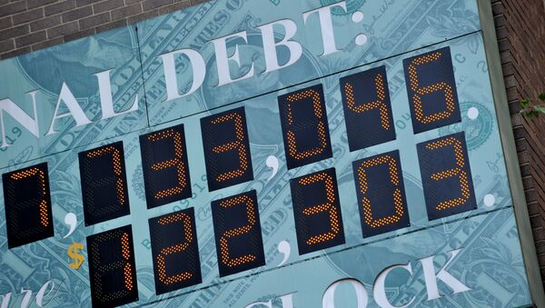 (File) Detail of the National Debt Clock, a billboard-size digital display showing the increasing US debt, on Sixth Avenue August 1, 2011 in New York - Sputnik International