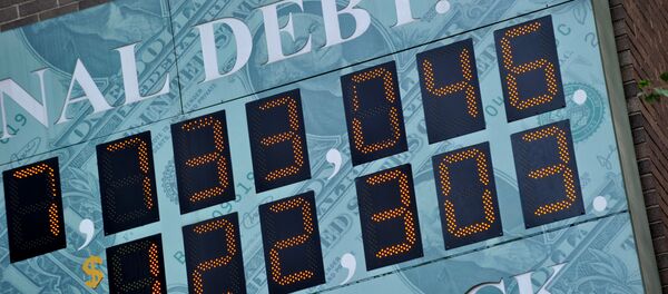 (File) Detail of the National Debt Clock, a billboard-size digital display showing the increasing US debt, on Sixth Avenue August 1, 2011 in New York - Sputnik International
