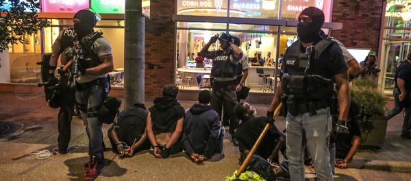 Police detain protesters arrested for causing damage to local businesses during the second night of demonstrations after a not guilty verdict in the murder trial of former St. Louis police officer Jason Stockley, charged with the 2011 shooting of Anthony Lamar Smith, who was black, in St. Louis, Missouri, U.S., September 16, 2017 Police detain protesters arrested for causing damage to local businesses during the second night of demonstrations after a not guilty verdict in the murder trial of former St. Louis police officer Jason Stockley, charged with the 2011 shooting of Anthony Lamar Smith, who was black, in St. Louis, Missouri, U.S., September 16, 2017 - Sputnik International