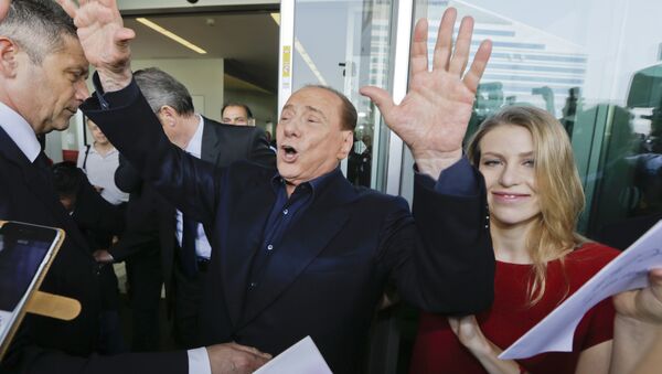In this file photo taken on July 3, 2015, AC Milan president Silvio Berlusconi waves to supporters flanked by his daughter Barbara, outside the Milanese soccer club's headquarters, in Milan, Italy. - Sputnik International