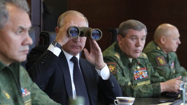 President Vladimir Putin seen while surveying the Russia and Belarus Union State armed forces activities at the main stage of the joint strategic exercises Zapad-2017) on the Luzhsky range - Sputnik International
