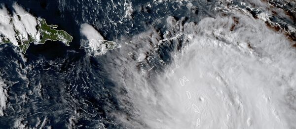 This Monday, Sept. 18, 2017, GOES East satellite image provided by NASA taken at 20:30 UTC, shows the eye of Hurricane Maria as it nears Dominica - Sputnik International