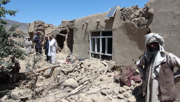 Afghan villagers gather near a destroyed house in Logar province, south of Kabul, Afghanistan (File) - Sputnik International