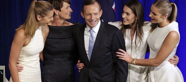 Australian opposition leader Tony Abbott, third left, and his daughters Frances, left, Louise, second right, and Bridget, right, and his wife Margaret, second left, come to the stage to celebrate his election victory in Sydney, Saturday, Sept. 7, 2013, following his win in Australia's national election. Australian opposition leader Tony Abbott, third left, and his daughters Frances, left, Louise, second right, and Bridget, right, and his wife Margaret, second left, come to the stage to celebrate his election victory in Sydney, Saturday, Sept. 7, 2013, following his win in Australia's national election. - Sputnik International