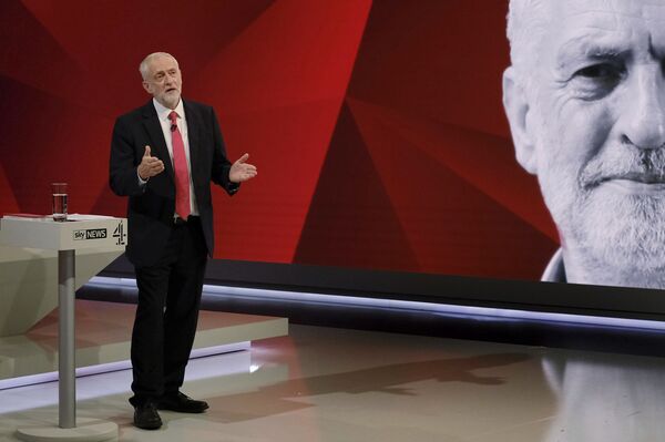 Labour leader Jeremy Corbyn, gestures. during a general election broadcast, in London, Monday May 29, 2017. Prime Minister Theresa May and Labour Party leader Jeremy Corbyn will face a live studio audience and a tough TV interviewer as the general election campaign moves to the airwaves. Labour leader Jeremy Corbyn, gestures. during a general election broadcast, in London, Monday May 29, 2017. Prime Minister Theresa May and Labour Party leader Jeremy Corbyn will face a live studio audience and a tough TV interviewer as the general election campaign moves to the airwaves. - Sputnik International