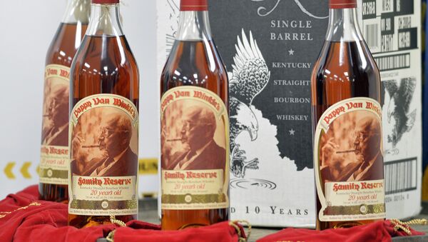 Recovered bottles of 20 year-old Pappy Van Winkle bourbon and Eagle Rare single barrel bourbon are shown during a news conference at the Franklin County Sheriff's Office, Tuesday, April 21, 2015, in Frankfort, Ky. - Sputnik International