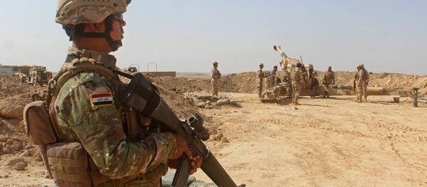Iraqi forces fire preliminary shells from the area of al-Sakrah, as they prepare a military operation to push out Islamic State (IS) group jihadists from the nearby village of Anah in the northwestern Anbar province - Sputnik International