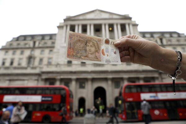 One of the new British 10 pound notes is posed for photographs outside the Bank of England in the City of London, Thursday, Sept. 14, 2017. One of the new British 10 pound notes is posed for photographs outside the Bank of England in the City of London, Thursday, Sept. 14, 2017. - Sputnik International