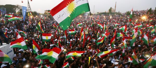 Iraqi Kurds fly Kurdish flags during an event to urge people to vote in the upcoming independence referendum in Arbil, the capital of the autonomous Kurdish region of northern Iraq, on September 16, 2017 Iraqi Kurds fly Kurdish flags during an event to urge people to vote in the upcoming independence referendum in Arbil, the capital of the autonomous Kurdish region of northern Iraq, on September 16, 2017 - Sputnik International