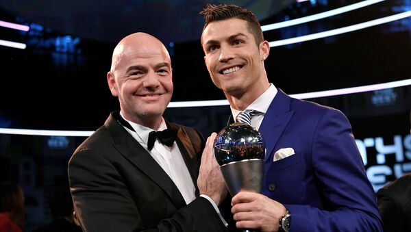 Real Madrid and Portugal's forward and winner of The Best FIFA Men’s Player of 2016 Award Cristiano Ronaldo (R) poses with FIFA president Gianni Infantino following The Best FIFA Football Awards 2016 ceremony, on January 9, 2017 in Zuric - Sputnik International