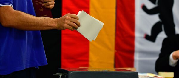 A man casts his ballot at a polling station in Berlin during general elections on September 24, 2017 - Sputnik International