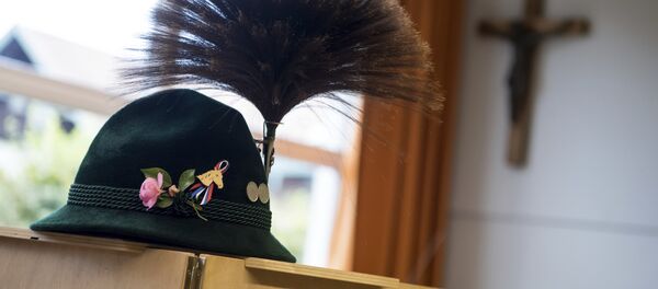 A traditional Bavarian hat with a chamois hair decoration sits on a polling booth during the German parliament election in Unterwoessen, southern Germany, Sunday, Sept. 24, 2017 A traditional Bavarian hat with a chamois hair decoration sits on a polling booth during the German parliament election in Unterwoessen, southern Germany, Sunday, Sept. 24, 2017 - Sputnik International