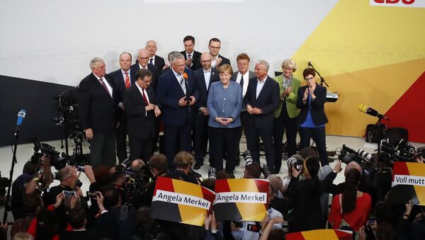 Christian Democratic Union CDU party leader and German Chancellor Angela Merkel reacts is congratulated by members of her party during the German general election (Bundestagswahl) in Berlin, Germany, September 24, 2017 - Sputnik International