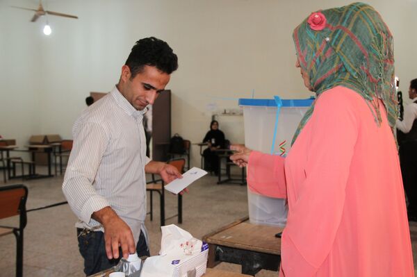 Voting at a polling station in the city of Kirkuk during an independence referendum for Iraqi Kurdistan - Sputnik International