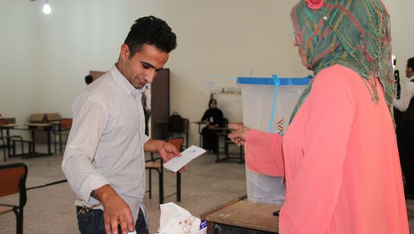 Voting at a polling station in the city of Kirkuk during an independence referendum for Iraqi Kurdistan - Sputnik International