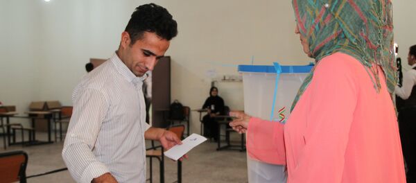 Voting at a polling station in the city of Kirkuk during an independence referendum for Iraqi Kurdistan - Sputnik International