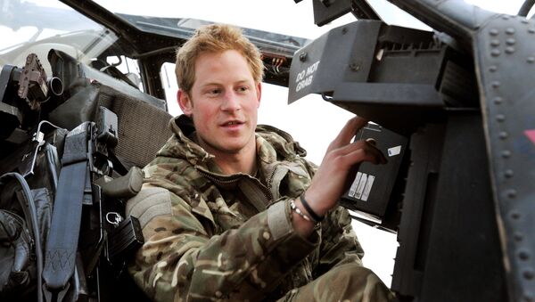 In this photo, taken 12 December 2012, made available 21 January 2013, Britain's Prince Harry or just plain Captain Wales as he is known in the British Army, makes his early morning pre-flight checks on the flight-line, from Camp Bastion southern Afghanistan.  - Sputnik International