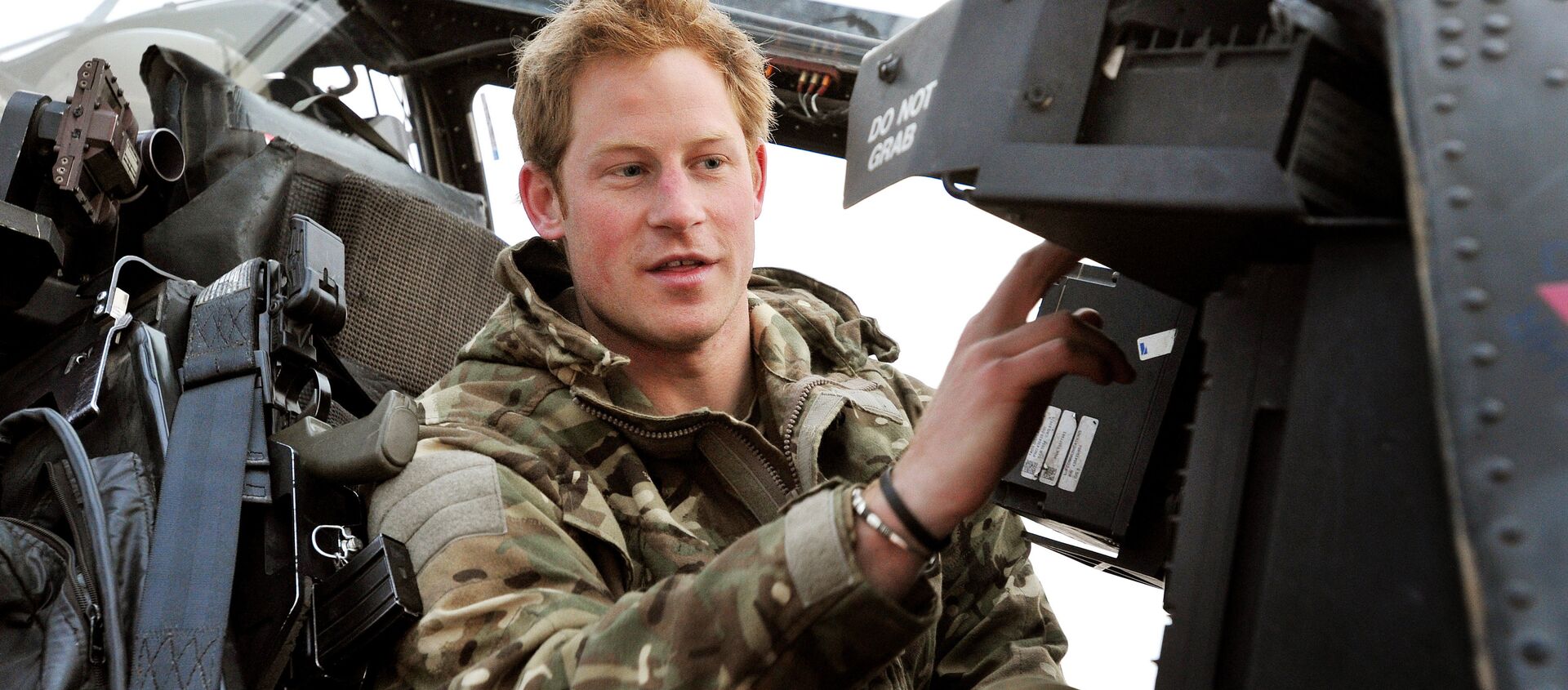In this photo taken Dec. 12, 2012, made available Monday Jan. 21, 2013 of Britain's Prince Harry or just plain Captain Wales as he is known in the British Army, makes his early morning pre-flight checks on the flight-line, from Camp Bastion southern Afghanistan.  - Sputnik International, 1920, 19.08.2021