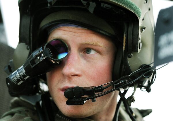 In this Dec. 12, 2012 file photo, Prince Harry wears his monocle gun sight as he sits in the front seat of his cockpit at the British controlled flight-line, in Camp Bastion, southern Afghanistan.  - Sputnik International