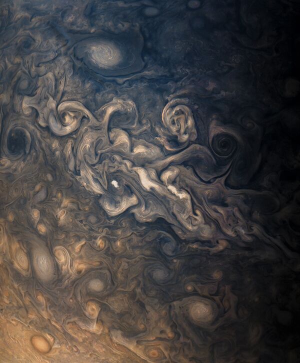 Jupiter's stormy atmosphere, photographed by Juno's JunoCam during the probe's eighth flyby. Jupiter's stormy atmosphere, photographed by Juno's JunoCam during the probe's eighth flyby. - Sputnik International