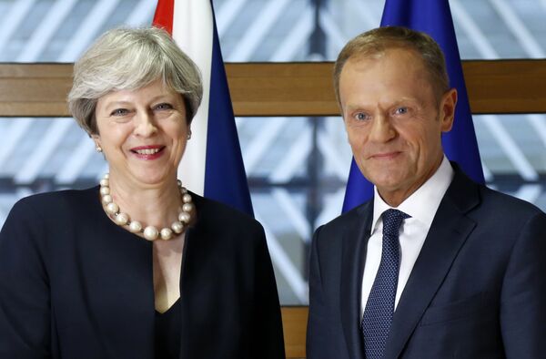 European Council President Donald Tusk, right, poses for photographers with British Prime Minister Theresa May prior to a bilateral meeting on the sidelines of an EU summit in Brussels on Thursday, June 22, 2017. European Council President Donald Tusk, right, poses for photographers with British Prime Minister Theresa May prior to a bilateral meeting on the sidelines of an EU summit in Brussels on Thursday, June 22, 2017. - Sputnik International
