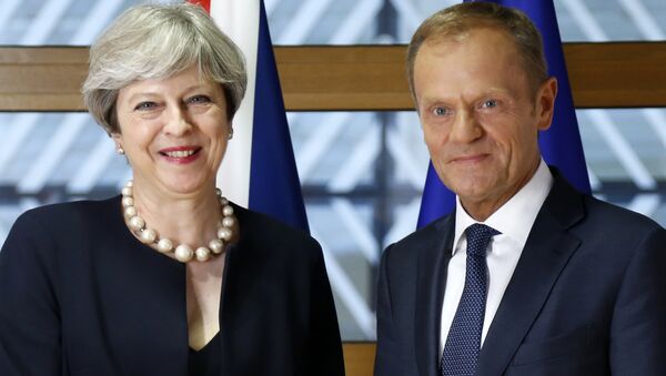 European Council President Donald Tusk, right, poses for photographers with British Prime Minister Theresa May prior to a bilateral meeting on the sidelines of an EU summit in Brussels on Thursday, June 22, 2017. - Sputnik International